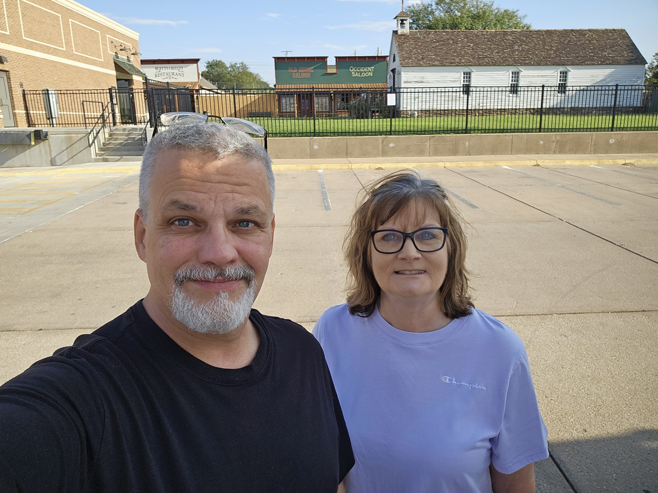 Travelers photographed with the Boot Hill and Front Street area in Dodge City.